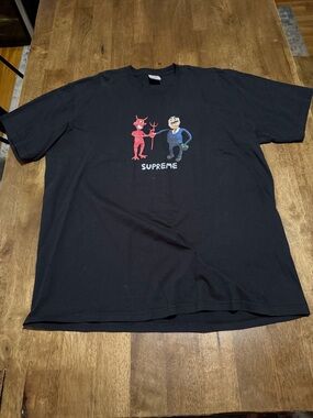 Supreme Black Tee with Red Devil and Blue Character Graphic